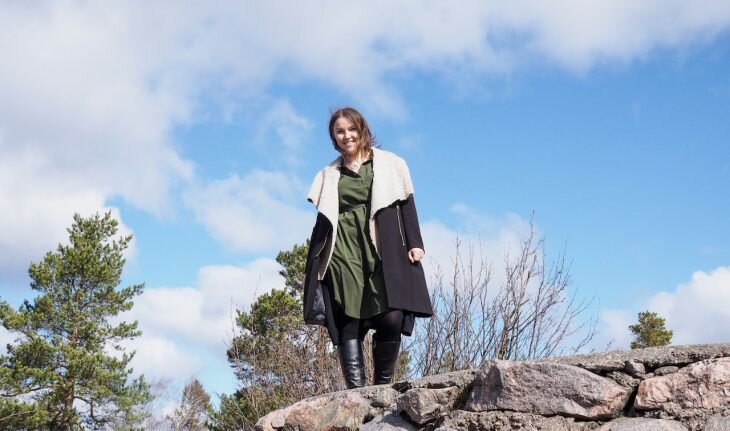 A woman standing on a wall